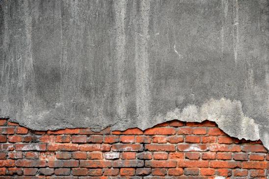 527820051 Broken concrete brick wall background